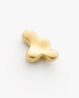 Abstract smooth metallic object on plain background.