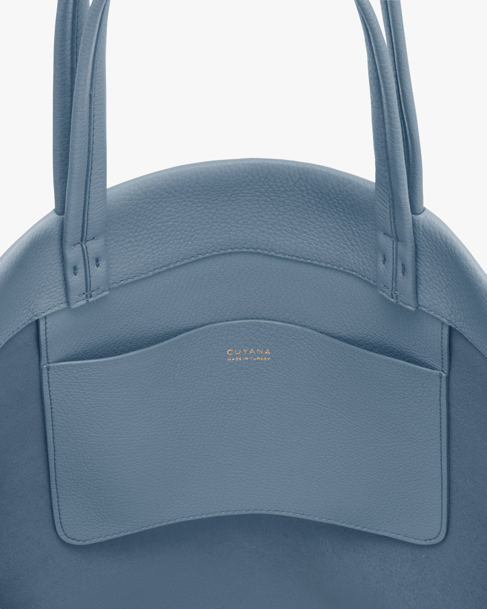 Round bag with two handles and a pocket on the front.
