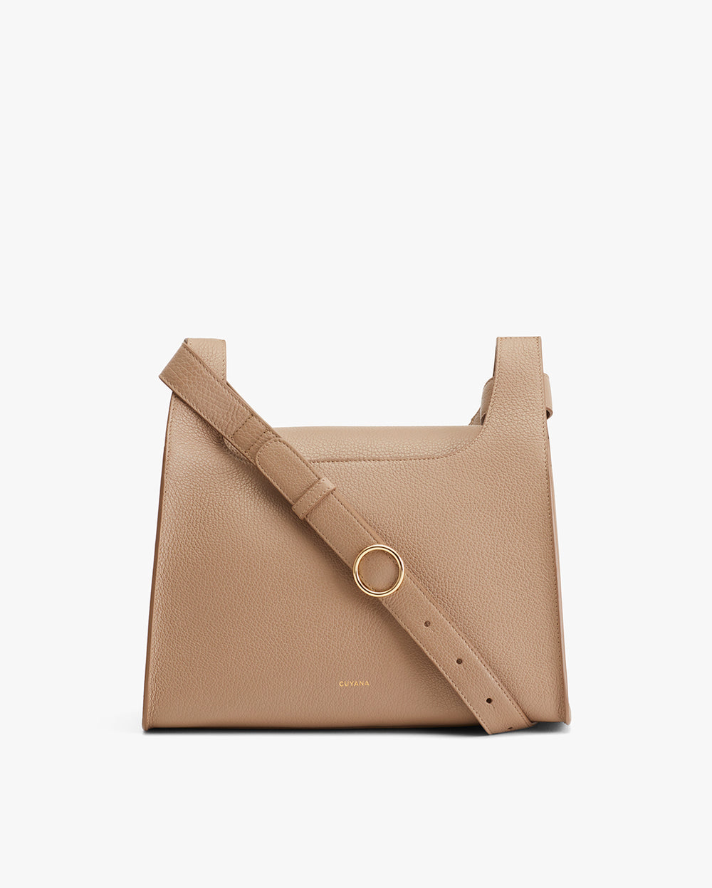 Handbag with a textured finish and adjustable strap, featuring a large front ring.
