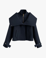Short jacket with wide collar and zip closure.