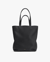 Tote bag with two handles and branded label at the bottom center.