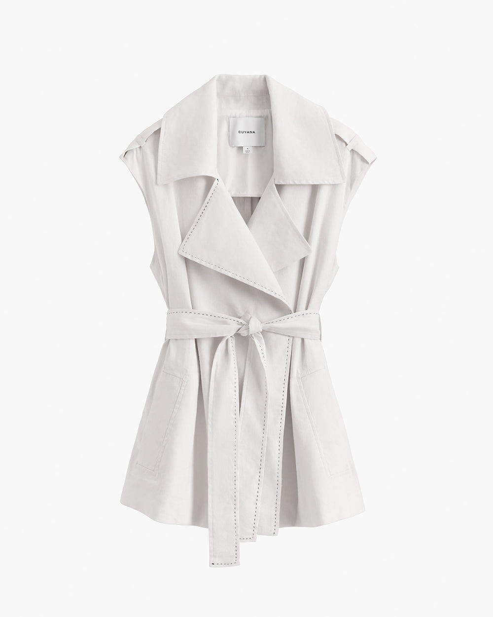 Sleeveless blouse with a collar, belt, and front lapels.