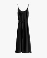 Sleeveless black long dress with tie on white background