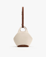 Handbag with a round handle and adjustable shoulder strap.