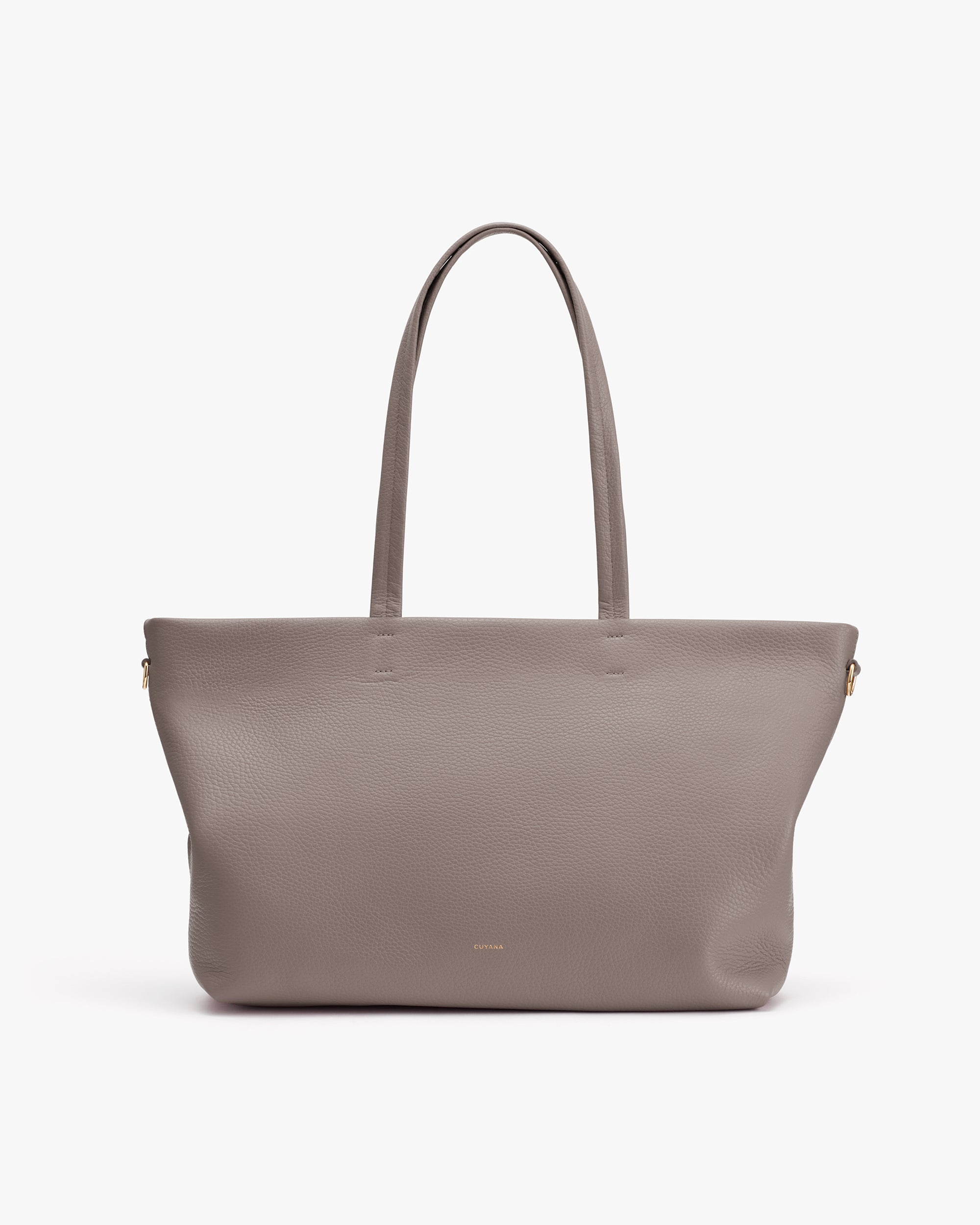 Tote bag with long handles on plain background.
