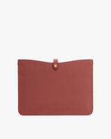 Rectangular textured leather pouch with a button closure on top.