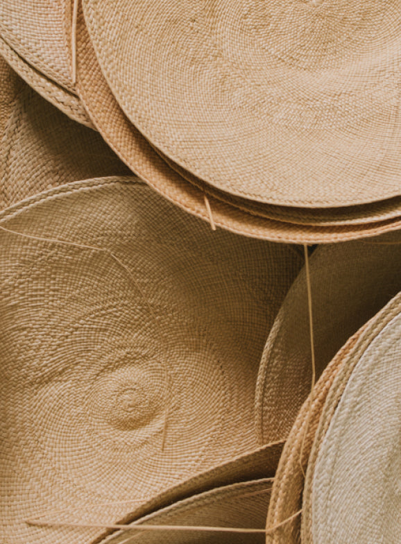 Stacked woven hats.