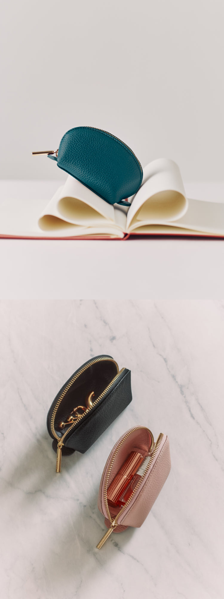 Small zippered pouches on a marble surface and open book.