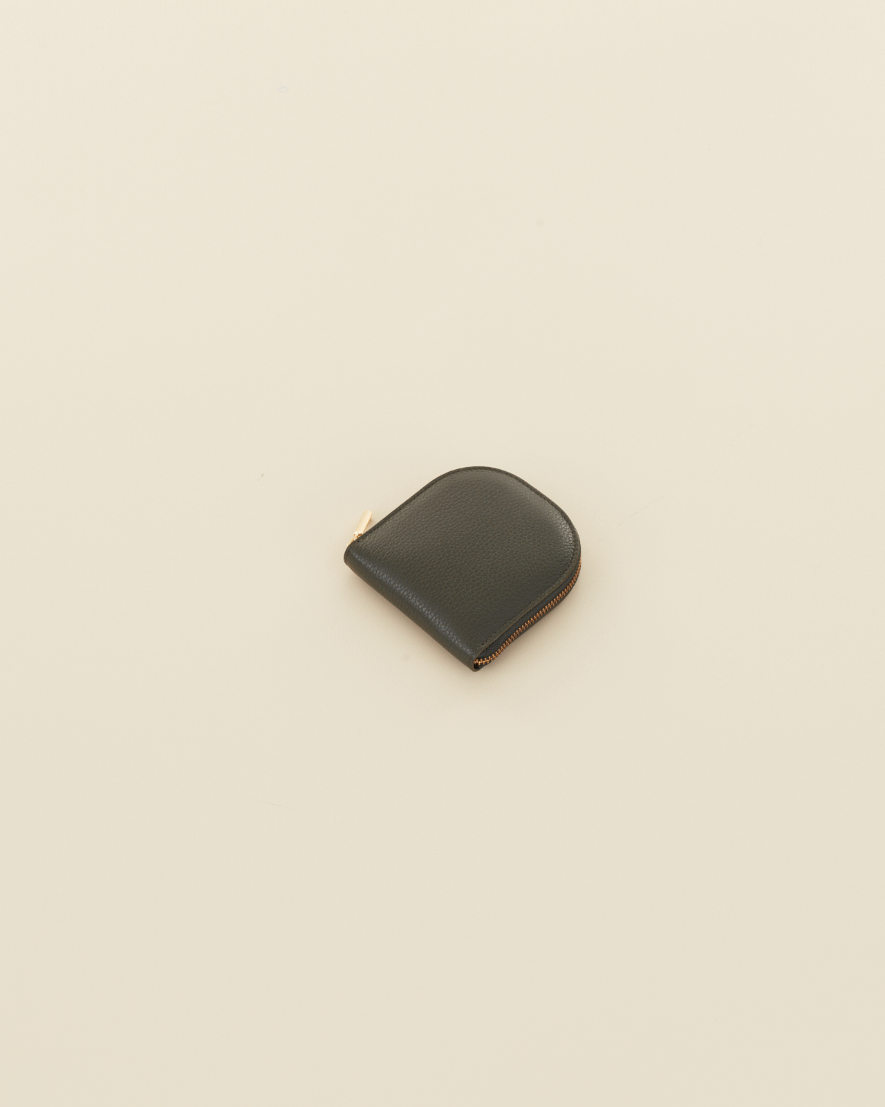 Wallet placed on a plain surface.