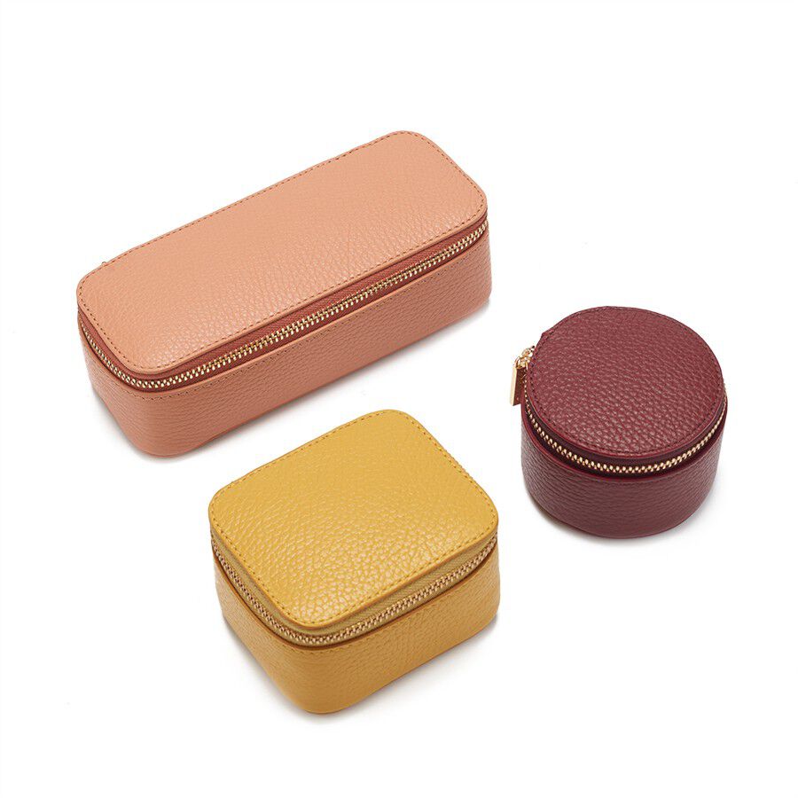 Three small zippered cases in different shapes.