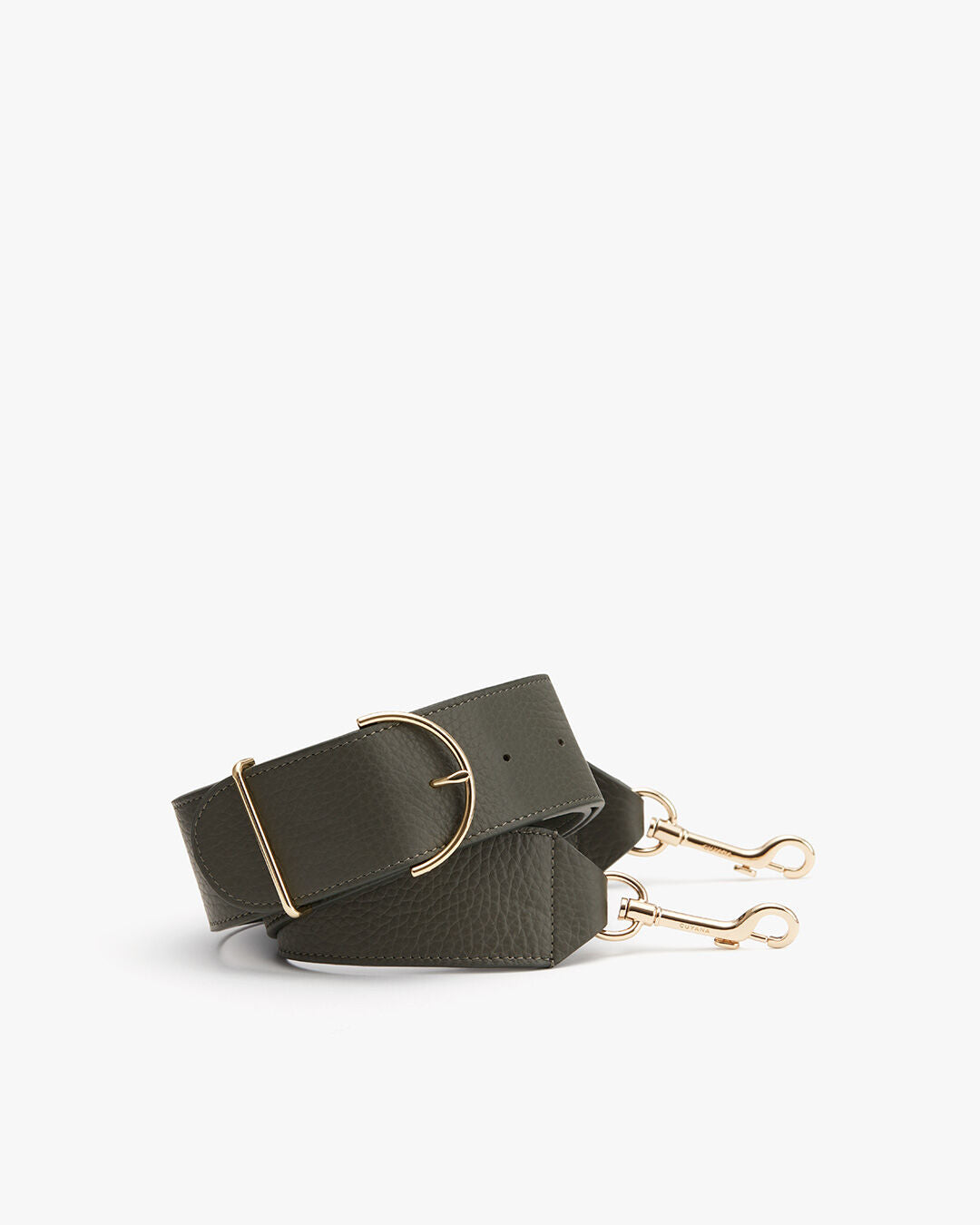 Rolled belt with a circular buckle and two clasps at the end.