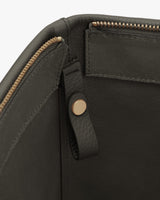 Close-up of a bag with zipper and snap fastener