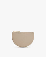 Small half-circle zippered purse on a plain background