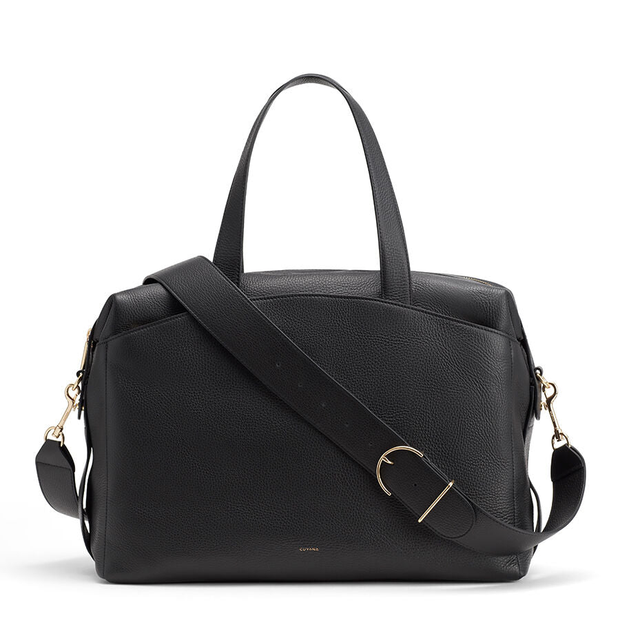 Handbag with top handles and a detachable shoulder strap.