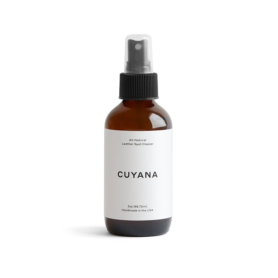 Spray bottle with label on white background