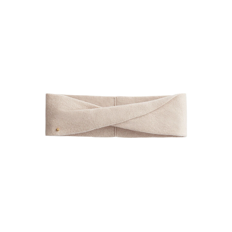 Twisted fabric headband with a button closure.